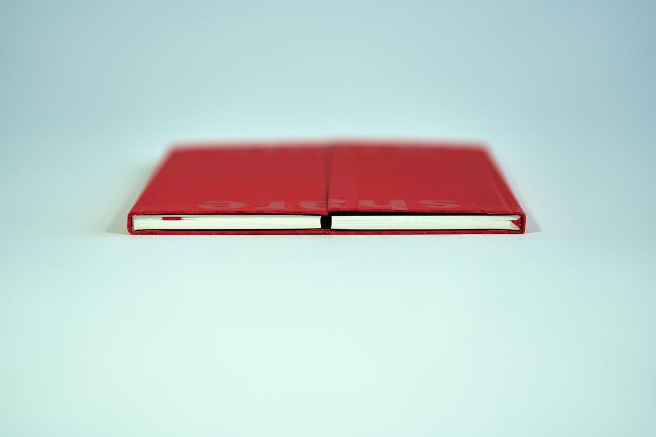 Two red hardcover book spines side by side BNB 2019 - The Sharing Book